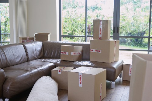 Prepared boxes and furniture ready for a moving truck in Elephant and Castle